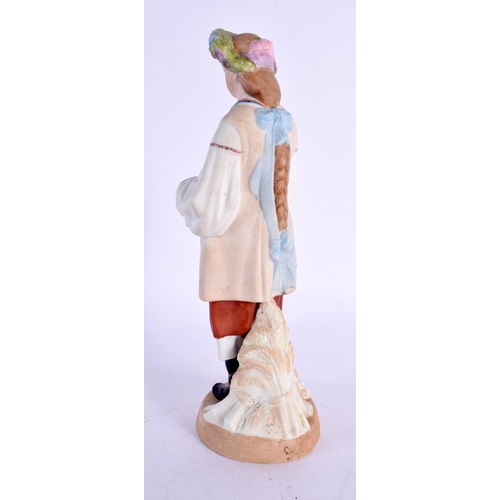 277 - A RUSSIAN PORCELAIN FIGURE OF A STANDING FEMALE modelled wearing a floral wreath. 22 cm high.