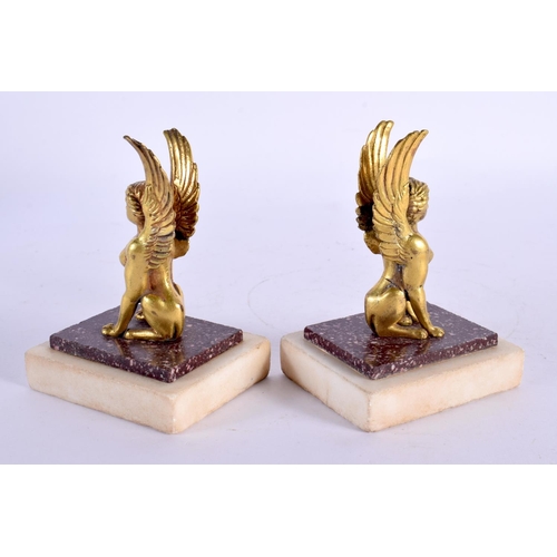 286 - A PAIR OF LATE 18TH CENTURY CONTINENTAL ORMOLU AND PORPHYRY FIGURES modelled as winged females. 9 cm... 