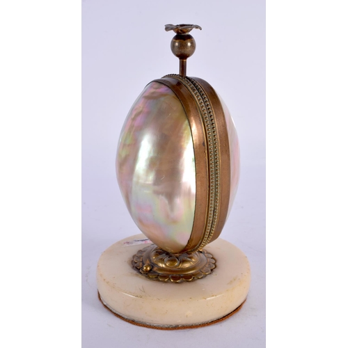 287 - A 19TH CENTURY FRENCH MOTHER OF PEARL GILT METAL SCENT BOTTLE HOLDER in the form of an egg. 14.5 cm ... 