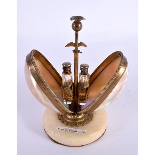 287 - A 19TH CENTURY FRENCH MOTHER OF PEARL GILT METAL SCENT BOTTLE HOLDER in the form of an egg. 14.5 cm ... 