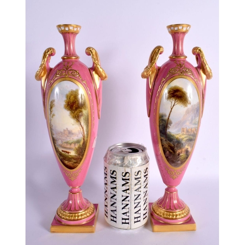 29 - A FINE PAIR OF 19TH CENTURY ROYAL WORCESTER TWIN HANDLED PINK GROUND VASES by Harry Davis, painted w... 