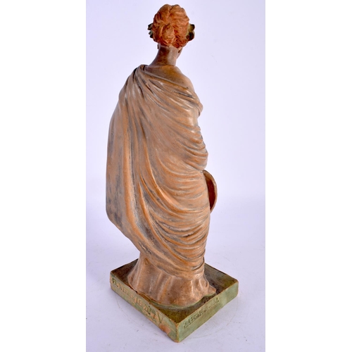 290B - AN ART NOUVEAU AUSTRIAN FIGURE OF A FEMALE modelled holding a fan. 25 cm high.