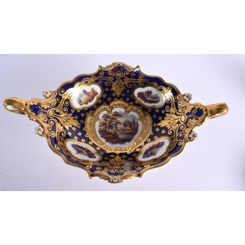 290 - A LARGE EARLY 19TH CENTURY ENGLISH TWIN HANDLED PORCELAIN COMPORT painted with landscapes. 40 cm x 1... 