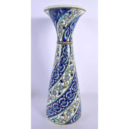 292 - A LARGE MIDDLE EASTERN TURKISH FLARED POTTERY VASE painted with spiralised flowers and vines. 40 cm ... 