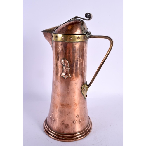 293B - A LARGE ARTS AND CRAFTS COPPER FLAGON overlaid with motifs. 30 cm high.