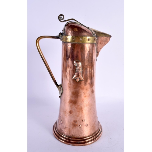 293B - A LARGE ARTS AND CRAFTS COPPER FLAGON overlaid with motifs. 30 cm high.