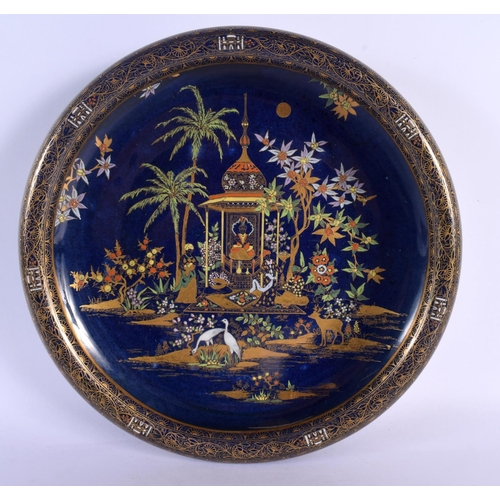 294 - A VERY RARE CARLTON WARE CIRCULAR BLUE GLAZED PORCELAIN BOWL unusually painted with mosques and East... 