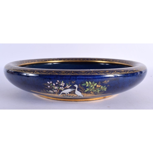 294 - A VERY RARE CARLTON WARE CIRCULAR BLUE GLAZED PORCELAIN BOWL unusually painted with mosques and East... 