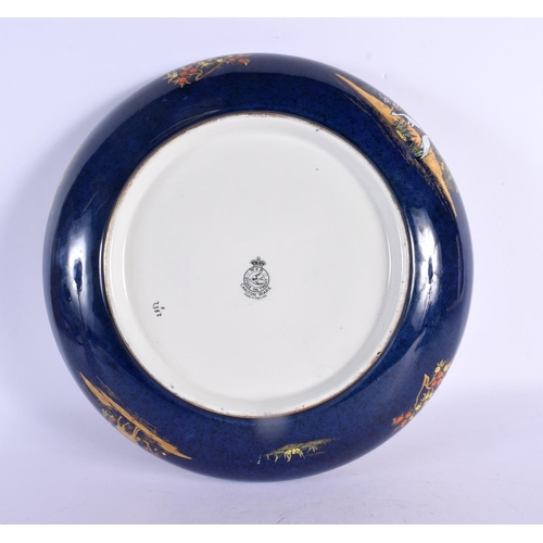 294 - A VERY RARE CARLTON WARE CIRCULAR BLUE GLAZED PORCELAIN BOWL unusually painted with mosques and East... 