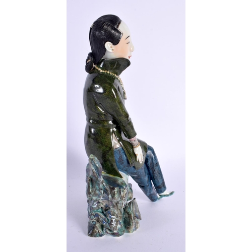 297B - AN EARLY 20TH CENTURY CHINESE GREEN GLAZED FIGURE OF A FEMALE Late Qing/Republic. 22.5 cm high.