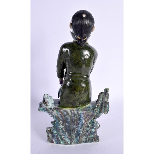 297B - AN EARLY 20TH CENTURY CHINESE GREEN GLAZED FIGURE OF A FEMALE Late Qing/Republic. 22.5 cm high.