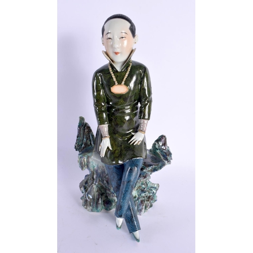 297B - AN EARLY 20TH CENTURY CHINESE GREEN GLAZED FIGURE OF A FEMALE Late Qing/Republic. 22.5 cm high.