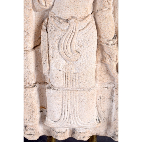 298D - A SOUTH EAST ASIAN CAMBODIAN CARVED STONE TEMPLE PANEL depicting a standing deity. 34 cm x 17 cm.