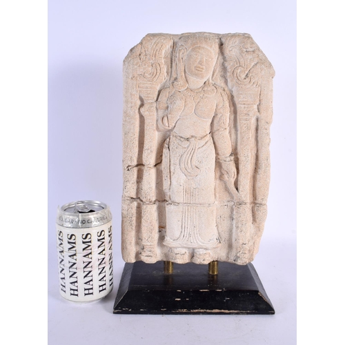 298D - A SOUTH EAST ASIAN CAMBODIAN CARVED STONE TEMPLE PANEL depicting a standing deity. 34 cm x 17 cm.