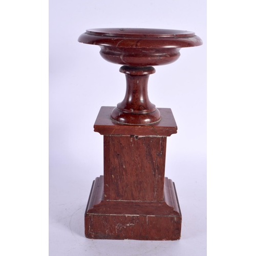 299A - A 19TH CENTURY EUROPEAN GRAND TOUR RED MARBLE PEDESTAL URN. 22 cm high.