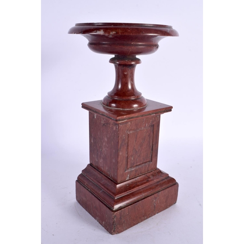 299A - A 19TH CENTURY EUROPEAN GRAND TOUR RED MARBLE PEDESTAL URN. 22 cm high.