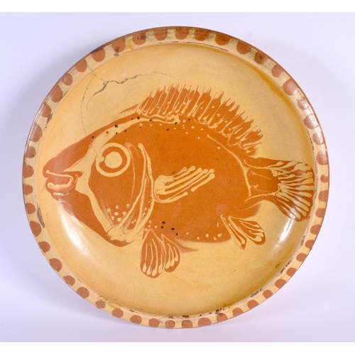 3 - A STYLISH STUDIO POTTERY SLIP DECORATED POTTERY GUNARD FISH DISH. 31 cm diameter.