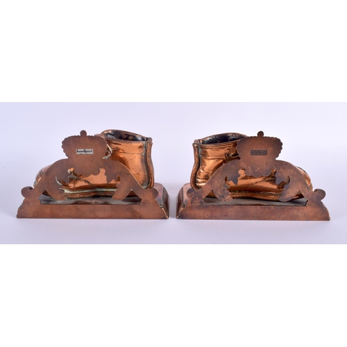 302 - A PAIR OF AMERICAN ALICE AMES OF BOSTON BRONZED COPPER BOOT DESK STANDS. 15 cm x 9 cm.