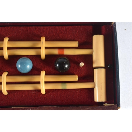 303 - A CHARMING BUSSEYS TABLE CROQUET SET. Box 26 cm x 12 cm.