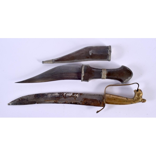 312 - A VINTAGE MIDDLE EASTERN WHITE METAL KNIFE and another horse head knife, both with inscribed blades.... 