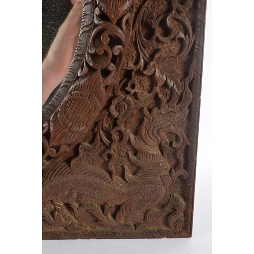 320 - AN EARLY 20TH CENTURY INDO THAI CARVED WOOD BURMESE TYPE MIRROR decorated with beasts and hunters. 5... 