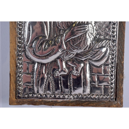 328 - A RUSSIAN SILVER MOUNTED WOOD ICON. 18 cm x 14 cm.