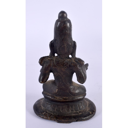 333 - AN 18TH CENTURY INDIAN BRONZE FIGURE OF A SEATED DEITY modelled with both hands outstretched. 11 cm ... 