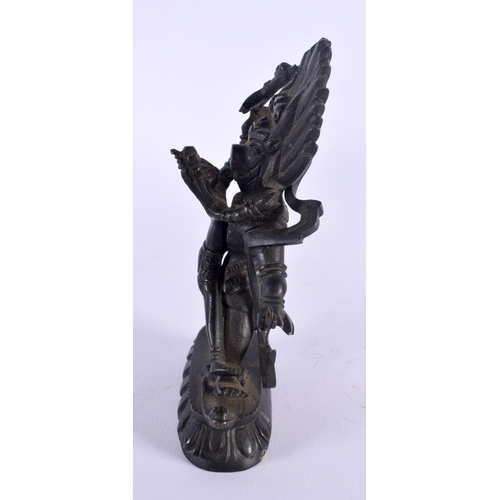 335 - A 19TH CENTURY TIBETAN BRONZE FIGURE OF A BUDDHISTIC BEAST modelled with consort. 14 cm x 6.5 cm.