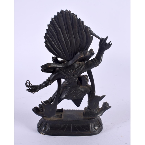 335 - A 19TH CENTURY TIBETAN BRONZE FIGURE OF A BUDDHISTIC BEAST modelled with consort. 14 cm x 6.5 cm.