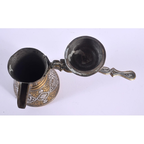 337 - A RARE 19TH CENTURY MIDDLE EASTERN SILVER INLAID CHOCOLATE POT decorated with calligraphy. 15 cm x 1... 