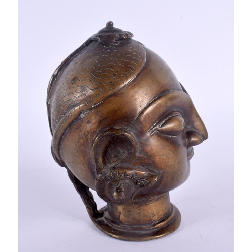 339 - AN UNUSUAL 18TH/19TH CENTURY INDIAN BRONZE BUDDHISTIC BUST modelled wearing coiled earrings. 15 cm x... 