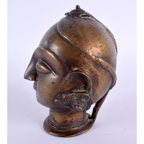 339 - AN UNUSUAL 18TH/19TH CENTURY INDIAN BRONZE BUDDHISTIC BUST modelled wearing coiled earrings. 15 cm x... 