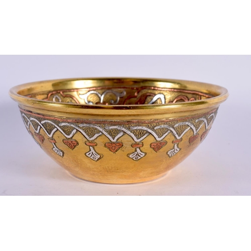 344 - A 19TH CENTURY MIDDLE EASTERN ISLAMIC SILVER INLAID BOWL decorated with scripture and motifs. 11 cm ... 