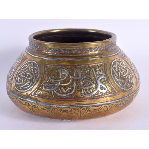 345 - A 19TH CENTURY MIDDLE EASTERN ISLAMIC SILVER INLAID CENSER decorated with scripture and motifs. 14 c... 