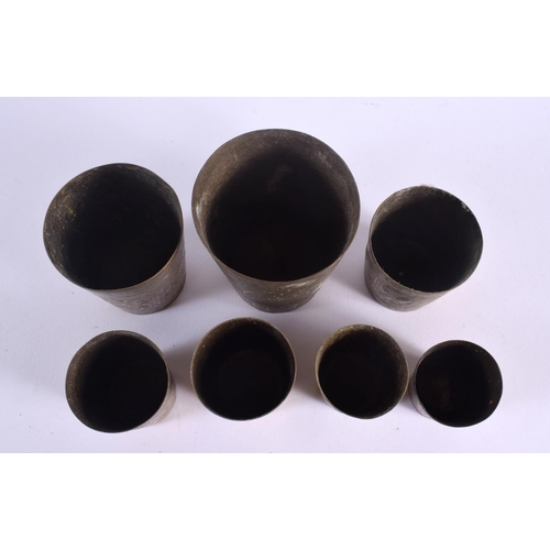 347 - SEVEN 19TH CENTURY INDIAN BRONZE BEAKERS. Largest 9.5 cm high. (7)