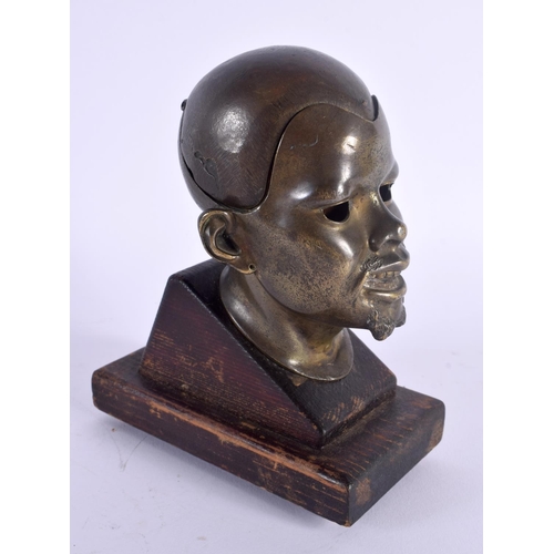 366 - A RARE 19TH CENTURY EUROPEAN BRONZE PORTRAIT HEAD INKWELL upon a wooden plinth. 17 cm high.