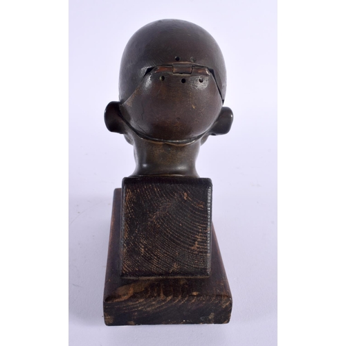 366 - A RARE 19TH CENTURY EUROPEAN BRONZE PORTRAIT HEAD INKWELL upon a wooden plinth. 17 cm high.