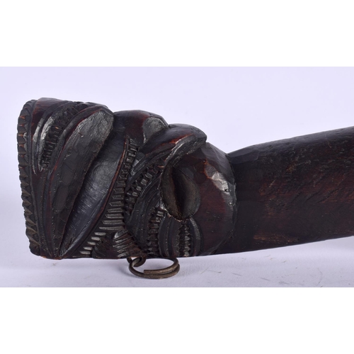 369 - AN UNUSUAL EARLY 20TH CENTURY MAORI TRIBAL NEW ZEALAND CARVED WOOD CLUB possibly a Wahaiki, with fla... 