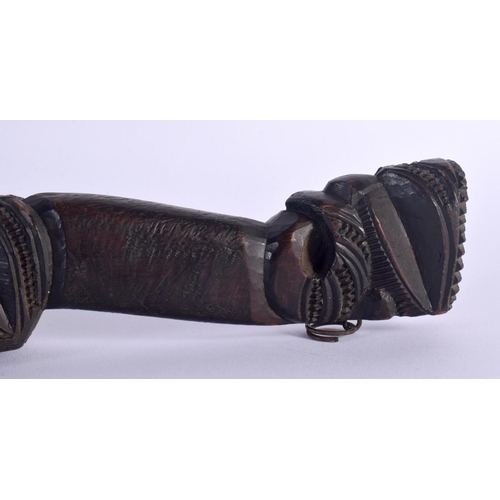 369 - AN UNUSUAL EARLY 20TH CENTURY MAORI TRIBAL NEW ZEALAND CARVED WOOD CLUB possibly a Wahaiki, with fla... 