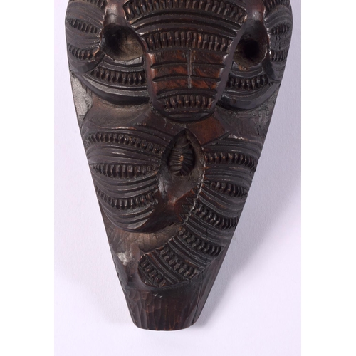 369 - AN UNUSUAL EARLY 20TH CENTURY MAORI TRIBAL NEW ZEALAND CARVED WOOD CLUB possibly a Wahaiki, with fla... 