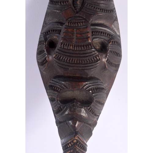 369 - AN UNUSUAL EARLY 20TH CENTURY MAORI TRIBAL NEW ZEALAND CARVED WOOD CLUB possibly a Wahaiki, with fla... 