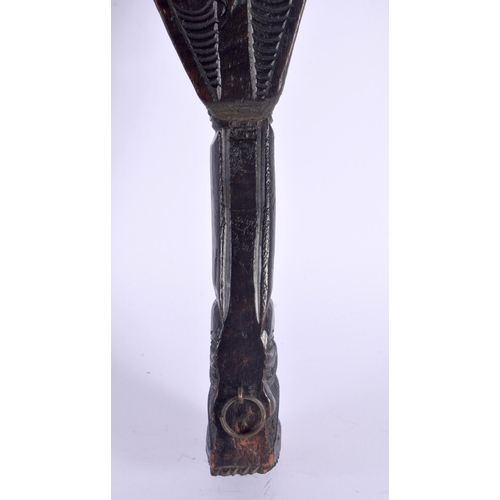 369 - AN UNUSUAL EARLY 20TH CENTURY MAORI TRIBAL NEW ZEALAND CARVED WOOD CLUB possibly a Wahaiki, with fla... 