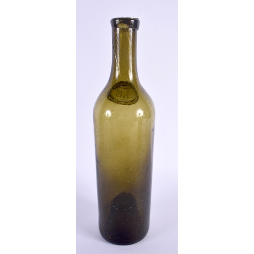 37 - A GREEN GLASS WINE BOTTLE bearing initials to front SS. 31 cm high.