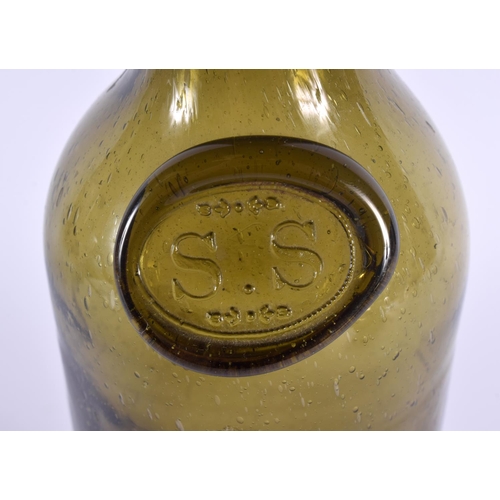 37 - A GREEN GLASS WINE BOTTLE bearing initials to front SS. 31 cm high.