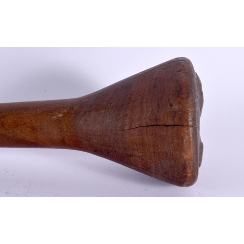 370 - AN EARLY 20TH CENTURY TRIBAL CARVED WOOD THROWING CLUB with dimpled terminal. 47 cm long.