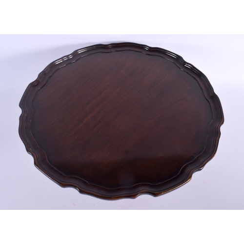 373 - AN EDWARDIAN MAHOGANY LAZY SUSAN. 35 cm wide.