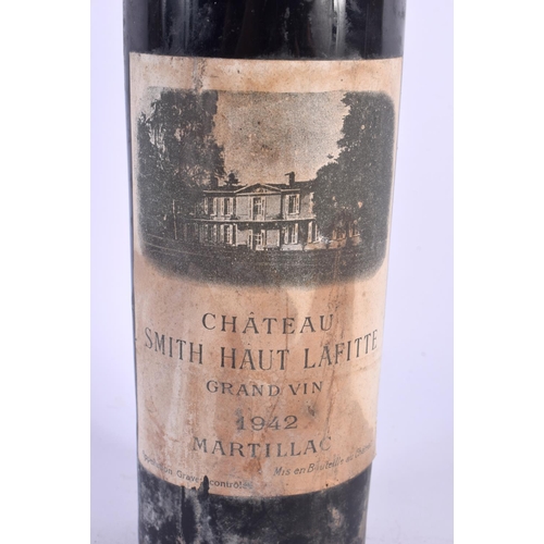 390 - A BOTTLE OF CHATEAU SMITH HAUT LAFITTE 1942 RED WINE. 31 cm high.