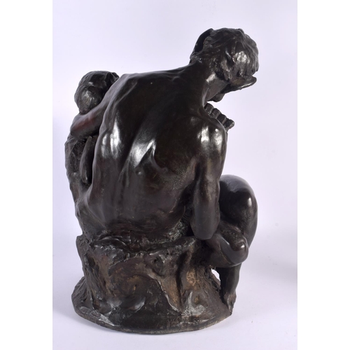 399 - A LARGE ART NOUVEAU BRONZED TERRACOTTA FIGURE OF PAN modelled with a nymph. 47 cm x 28 cm.