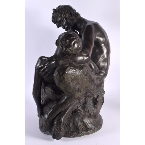 399 - A LARGE ART NOUVEAU BRONZED TERRACOTTA FIGURE OF PAN modelled with a nymph. 47 cm x 28 cm.