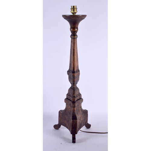 402 - A LARGE 18TH CENTURY EUROPEAN PROVINCIAL CARVED WOOD LAMP. 59 cm high.